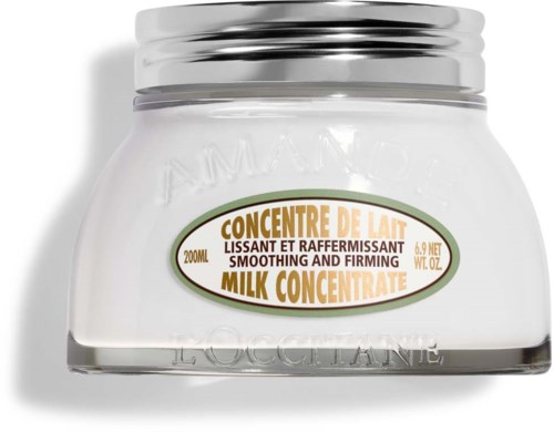 En vit burk med silvertätning, märkt som mjölkkoncentrat för att jämna ut och stärka huden, 200 ml.