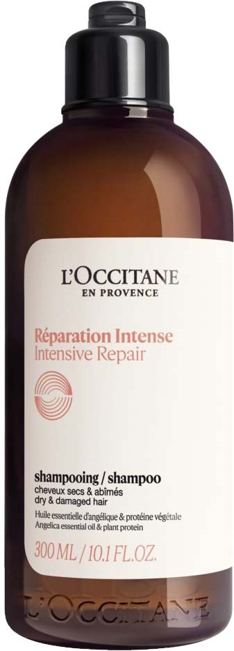 Bruine shampoo fles met zwarte dop, wit label met rode en zwarte tekst, 300 ml, voor beschadigd haar.