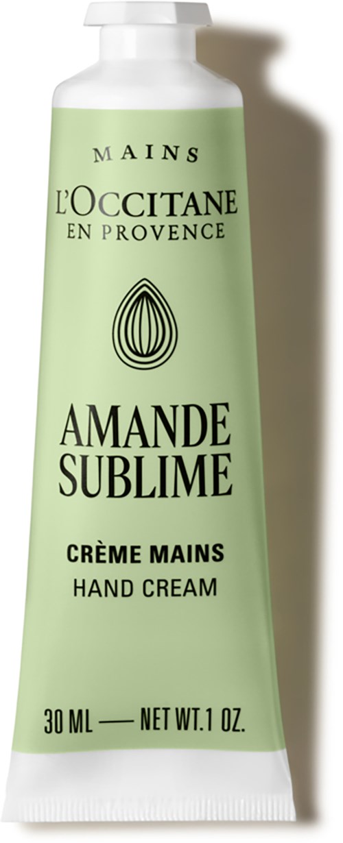 Eine hellgrüne Tube mit L'Occitane Handcreme, schwarzem und weißem Text und schwarzem Logo.