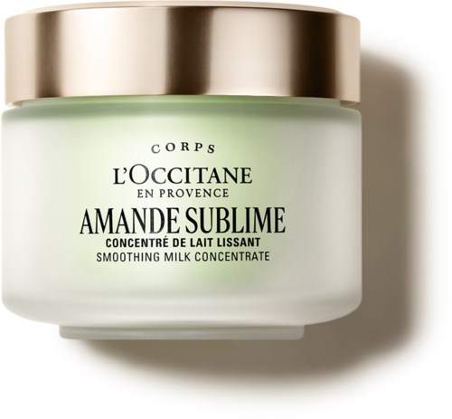 A jar of L'OCCITANE Amande Sublime smoothing milk concentrate with a gold lid.