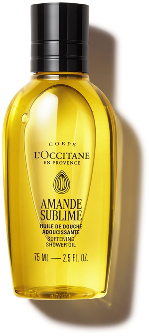 Gelbe Flasche mit schwarzem Deckel von L'Occitane, beschriftet Amande Sublime, enthält pflegende Duschöl.