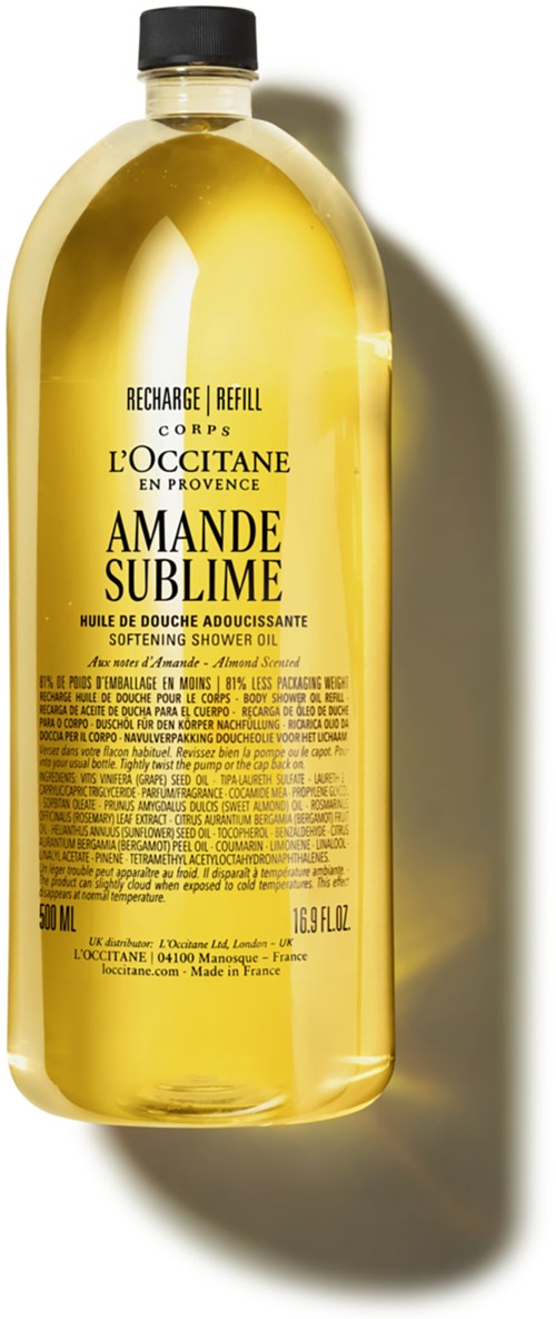 Eine gelbe Flasche mit feuchtigkeitsspendendem Duschöl, schwarzer Deckel, beschriftet "L'Occitane Amande Sublime" und Zutaten.