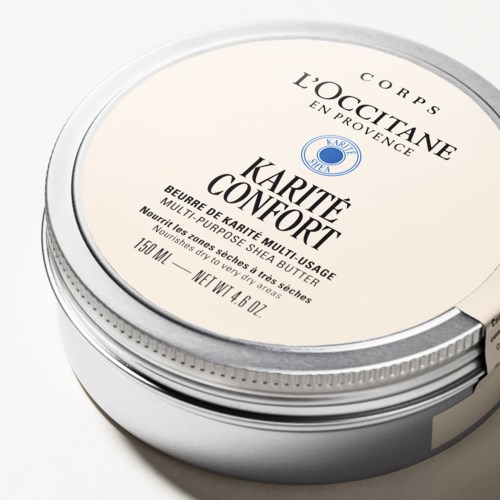 Ein runder Behälter mit L'Occitane-Körperbutter, beige Deckel, schwarzer Text, blauer Logo.