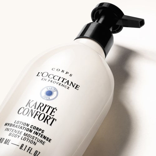 Eine weiße Lotionflasche mit schwarzem Pumphahn, beschriftet als L'Occitane Karite Confort intensiv Feuchtigkeitslotion.