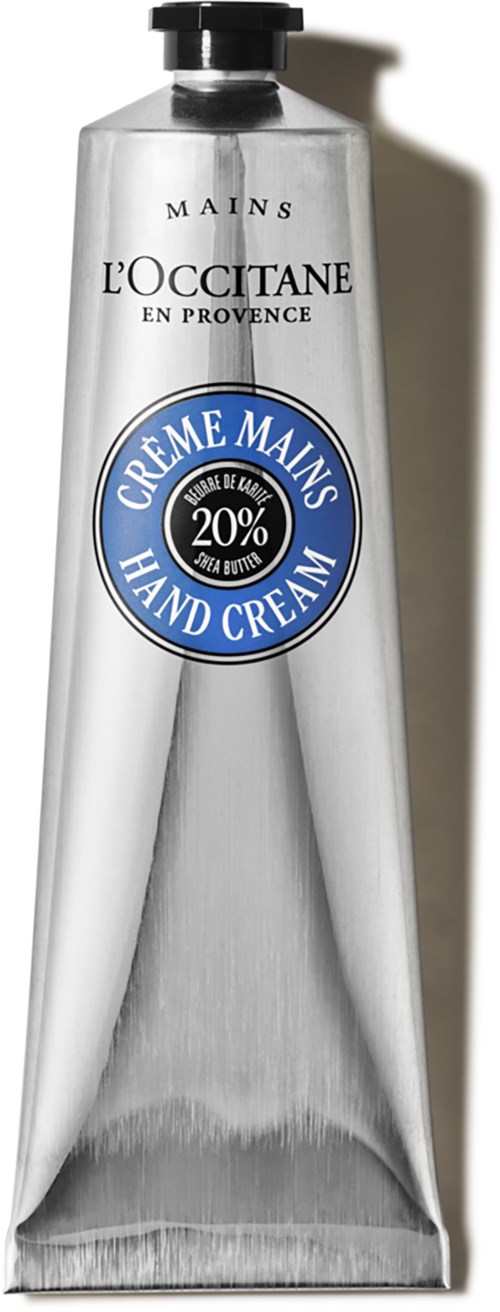 En silverrör med L'OCCITANE handkräm med svart lock, märkt med 20% sheasmör.