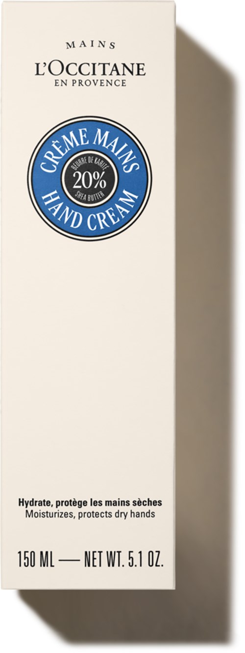 En vit förpackning för handkräm från L'Occitane med blå och svart text, visar att den innehåller 20% sheasmör.