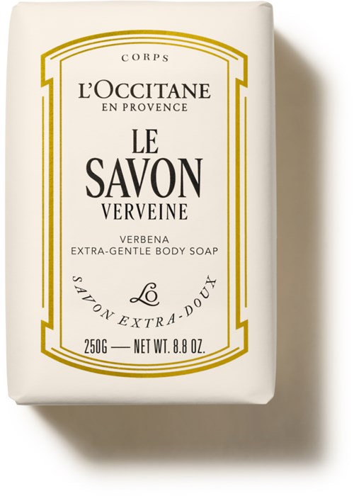 Eine weiße Seifenverpackung mit schwarzen und goldenen Texten, zeigt die Marke L'Occitane und Seifenangaben.