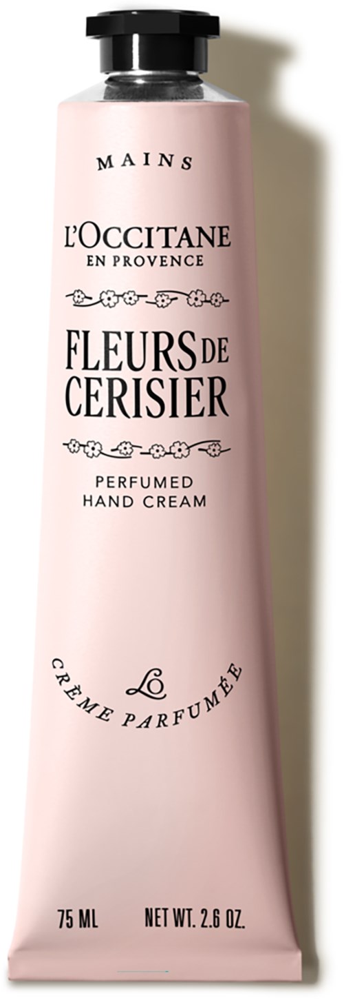Eine pinke Tube Handcreme mit schwarzem Deckel, mit L'Occitane Körbchnblütenduft, 75ml.