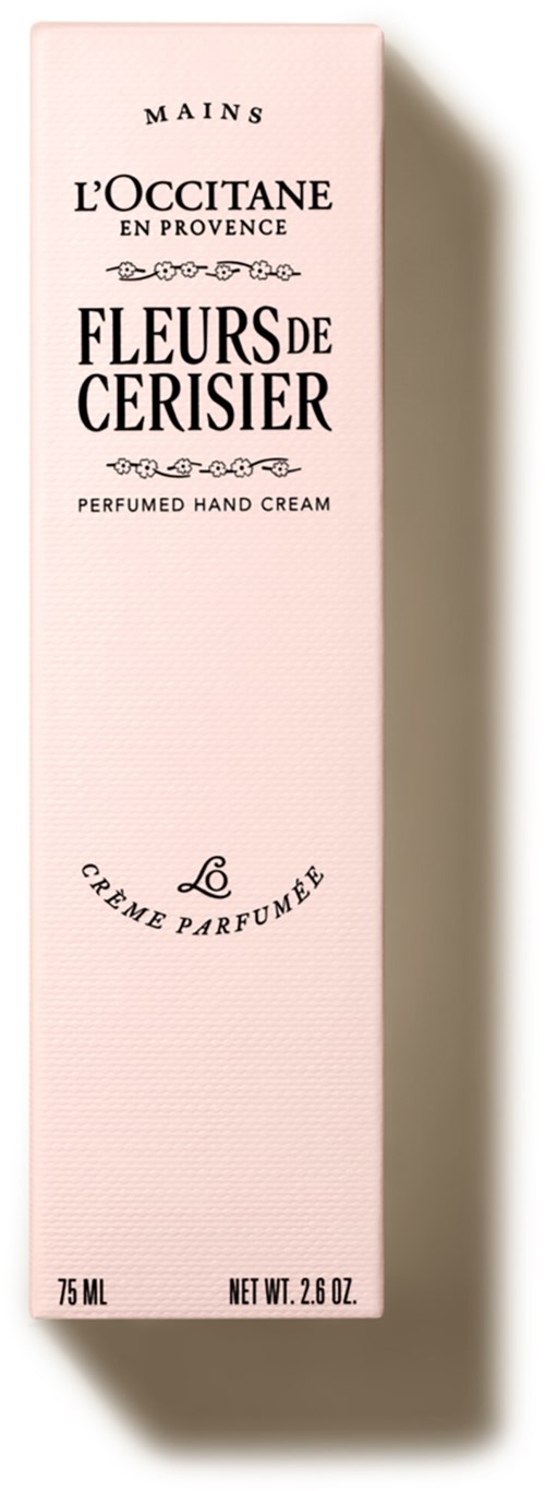 Eine rosa Packung mit L'Occitane Handcreme, schwarzer Text in eleganter Schrift, französische Ausdrücke, steht aufrecht.
