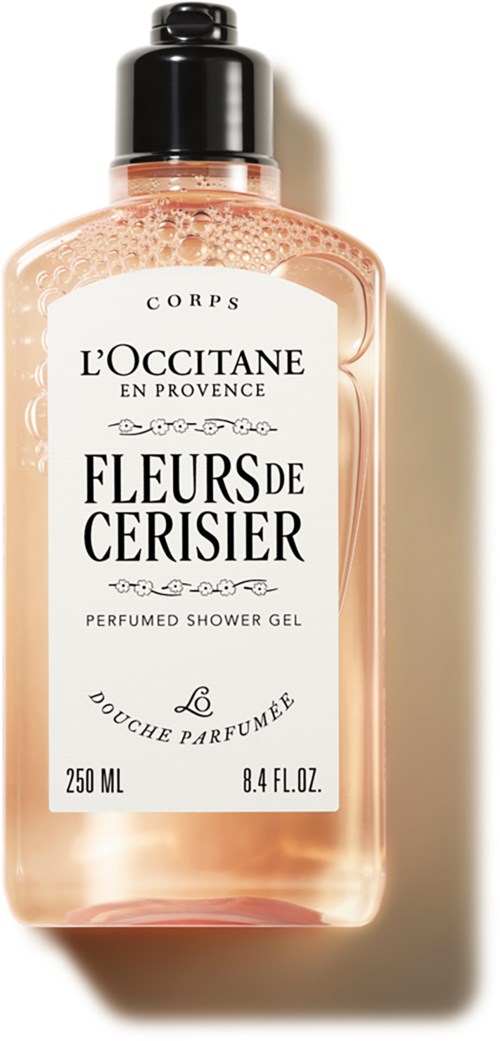 Eine rosa Duschgel-Flasche mit schwarzem Deckel, gekennzeichnet "Fleurs de Cerisier" von L'Occitane, 250 ml.
