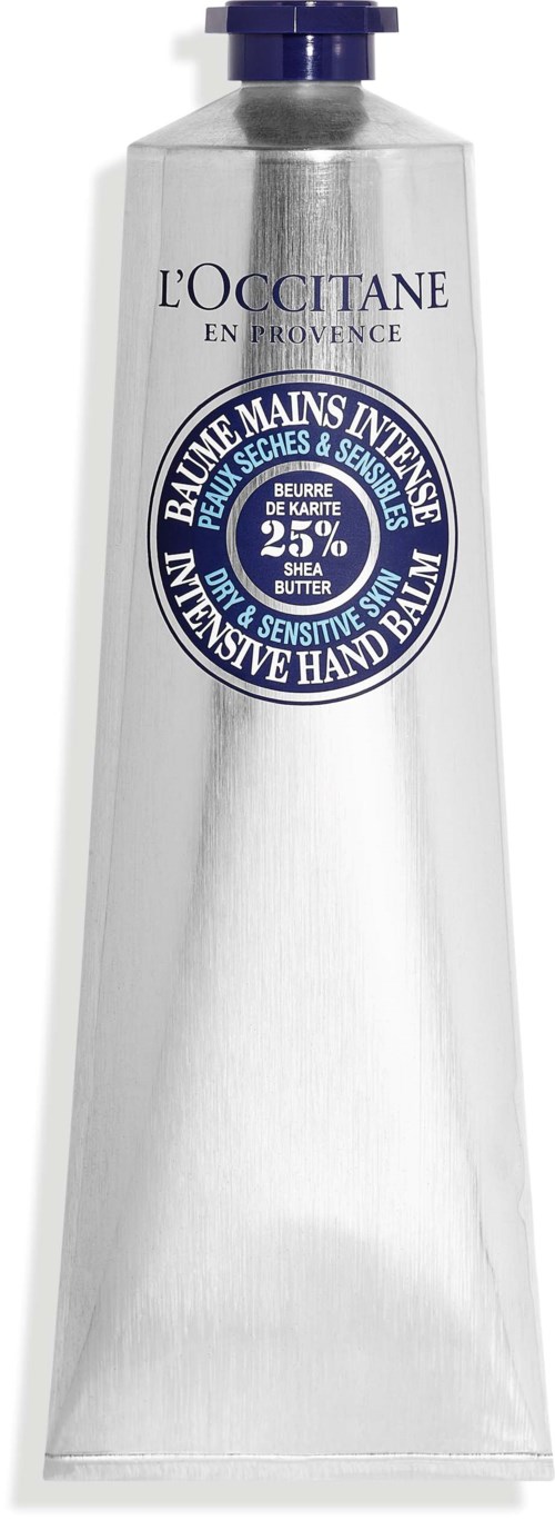 En vit handkrämstube med en lila pump, märkt L'Occitane, för torra och känsliga händer med 25% sheasmör.