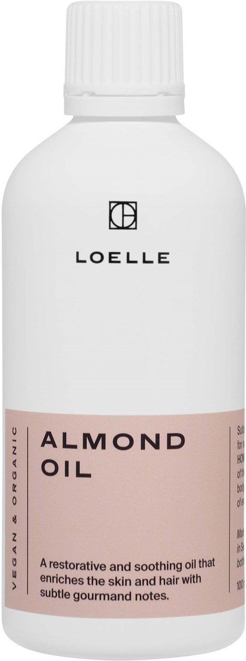 A white bottle with a pink label that says "Almond Oil" and describes it as a soothing skin and hair oil.