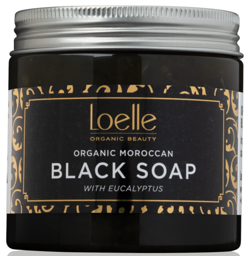 A dark jar with a silver lid. The label says "Loelle" and mentions organic Moroccan black soap with eucalyptus.