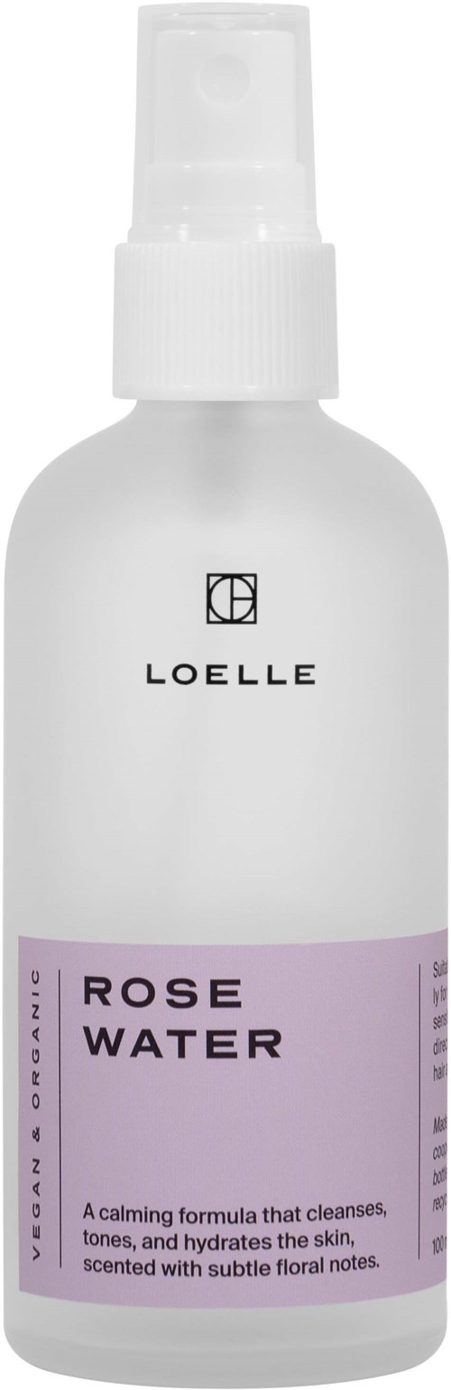 A white spray bottle labeled 'Rose Water' with a purple band, used for skin care and hydration.