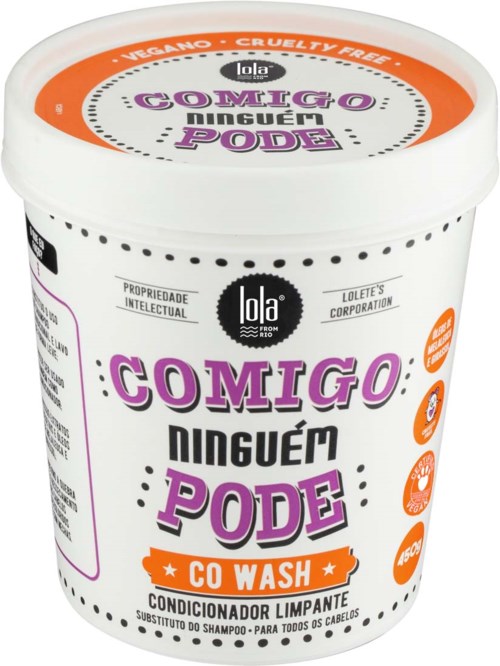 A white container with purple and black text, promoting vegan, cruelty-free hair conditioner that can substitute shampoo.