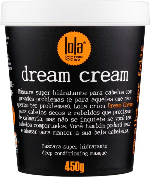 Svart beholder med oransje og hvit tekst, merket "dream cream" for hår, inneholder 450g. Latinamerikansk merking.