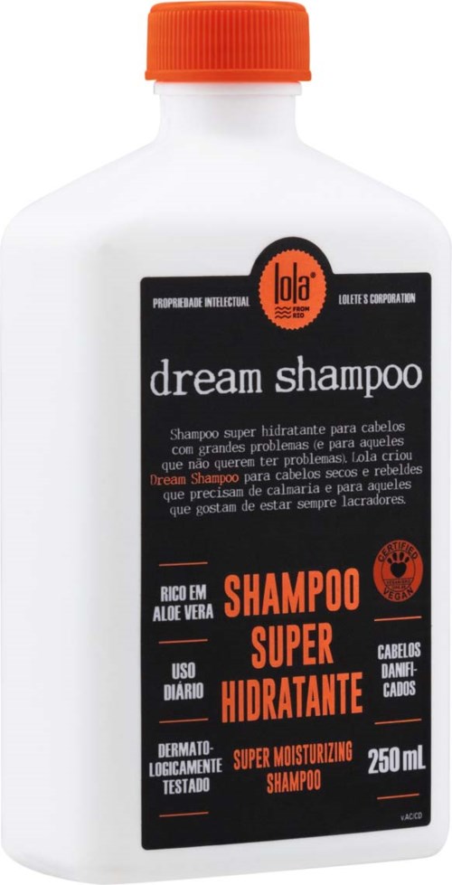 A white shampoo bottle with an orange cap, black and orange label, and text about moisturizing hair care.