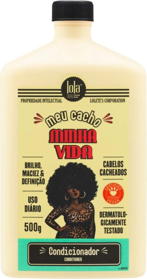 A 500g bottle of hair conditioner, featuring a woman with curly hair, leopard print dress, and bold red text.
