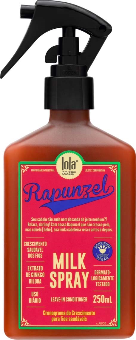 Ruskea suihkepullo, jonka kyljessä lukee "Milk Spray" ja jossa on musta suihkupää ja vihreä, pinkki ja keltainen teksti ja suunnittelu.