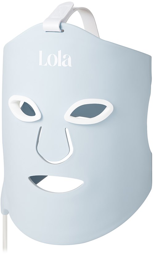 A face mask with eye holes, nose cutout, and mouth opening hanging on a hook, labeled Lola.
