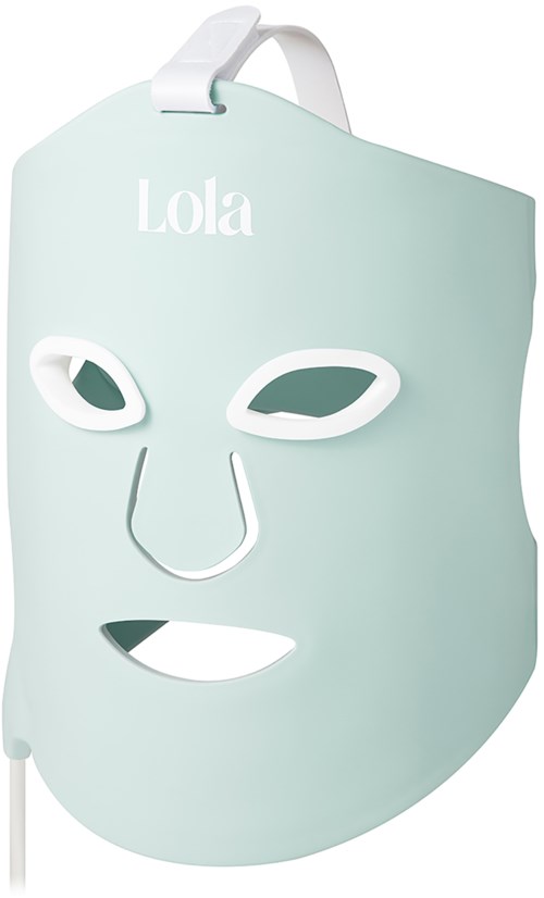 A light blue mask with two eye holes, a nose and a mouth cutout, and the name Lola on top.