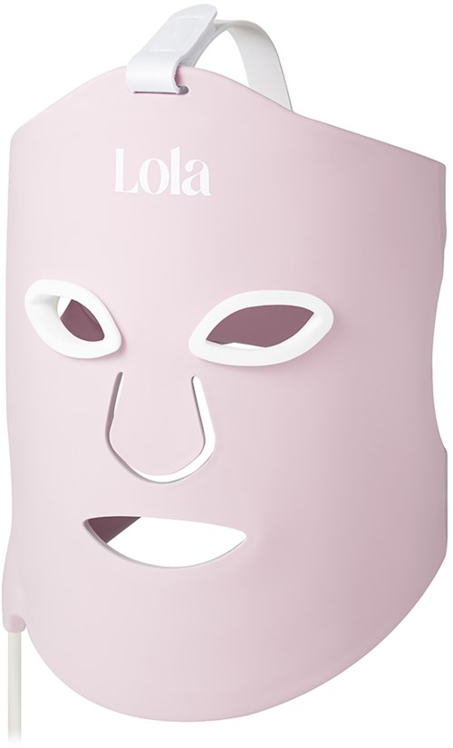 A pink face mask with eye holes, nose, and mouth cutouts. The mask has the word Lola at the top.