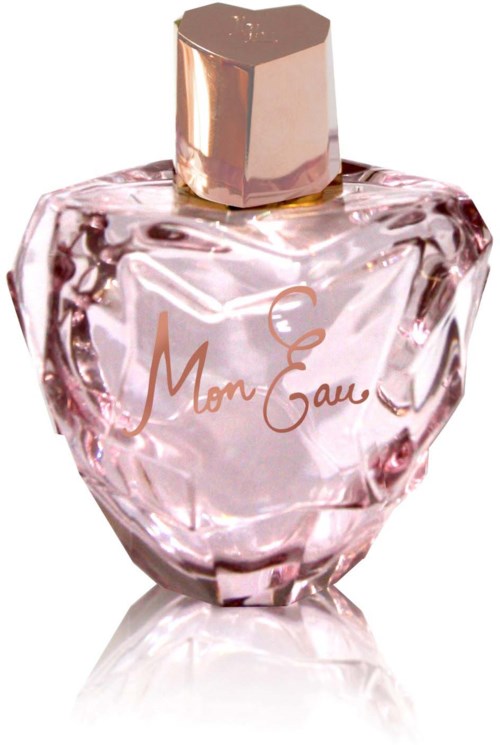 A pink perfume bottle with a gold cap and elegant writing on it.
