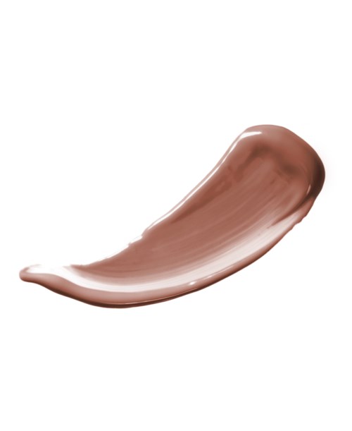 En strimma av brunt krämsmör eller make-up som är utbredd på en vit bakgrund.