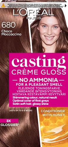 En L'Oréal hårfärgspaket med en leende kvinna, visar hårfärgen, produktnamnet och fördelar som framhäver glans och hudvård.