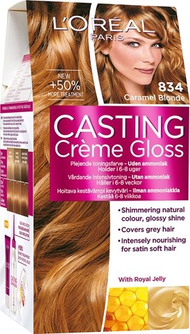 Een doos voor blond haarkleur met een vrouw die glanzend, lichtblond haar toont en productdetails op de voorkant.
