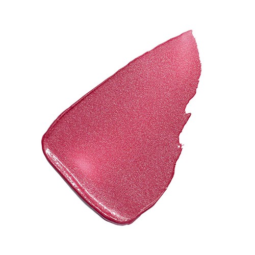 En rosa makeuprouge med glitter, i en böjd form med en liten sprucken kant.