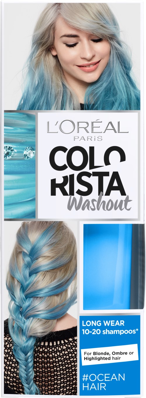 En kvinna med blått hår som ler, håller en box med L'Oréal hårfärg, visar sitt hår stylat med färgen.