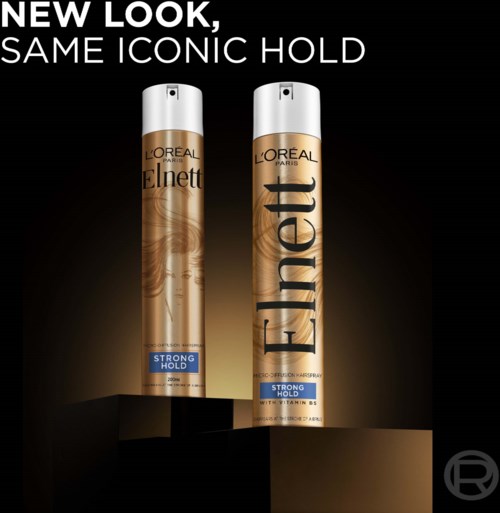 Zwei Flaschen L'Oreal Elnett Haarspray mit starker Haltbarkeit stehen auf einer schwarzen Oberfläche vor dunklem Hintergrund.