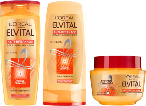 Tre hårpleieprodukter, sjampo, balsam og maske, alle fra L'Oréal sitt Elvital-sortiment for skadet hår.