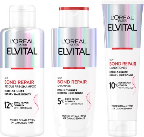 Drie verschillende haarverzorgingsproducten van L'Oréal Paris Elvital, inclusief shampoo, conditioner en reddingspre-shampoo.