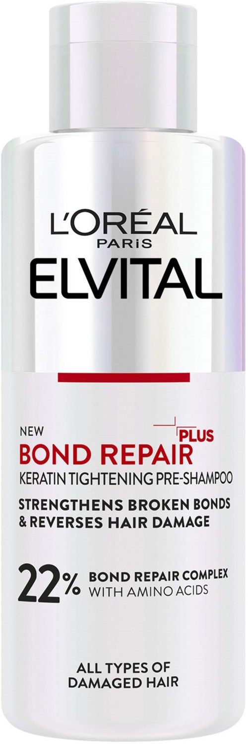 A white bottle labeled L'Oréal Elvital Bond Repair Plus pre-shampoo for damaged hair, with red and black text.