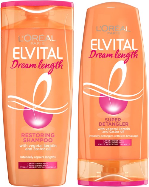 Två orange flaskor med schampo och balsam från L'Oreal Elvital Dream Length-serien med rosa lock och etiketter.