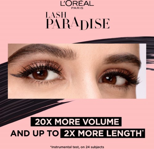 Close-up of eyes with long lashes, promoting lash extension product called Lash Paradise by L'Oréal Paris.
