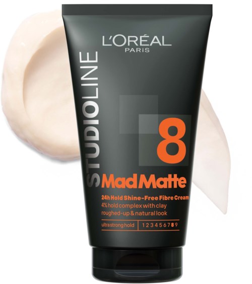 Een zwarte tube L'Oréal Mad Matte 24-uurs haarstyling crème, met oranje en grijze tekst en wat crème ernaast.