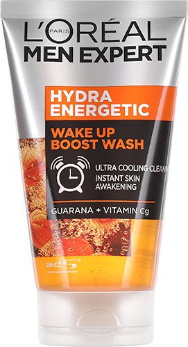 Eine Tube L'Oréal Men Expert Hydra Energetic Gesichtswaschmittel mit orange-schwarzem Etikett und Spritzbild.