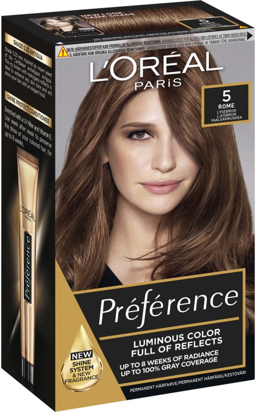 Eine Haarfärbekarton zeigt eine Frau mit langen, glänzenden braunen Haaren und enthält Produktinformationen und Markenlogo.