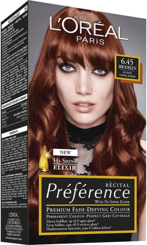 L'Oréal hårfärgningsförpackning med en kvinna som har långt, vågigt rödaktigt hår och stark make-up.