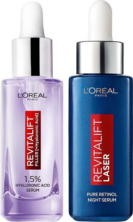 Zwei L'Oréal-Hautpflegeflaschen: eine lila mit Hyaluronsäure, eine blaue mit reinem Retinol, beide mit Tropfverschluss.