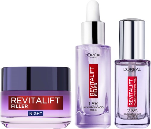 Drei Hautpflegeprodukte von Loreal, inklusive Nachtcreme und Seren mit Hyaluronsäure. Lila und silberne Verpackungen.
