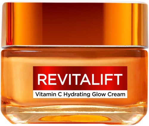 A jar of cream with a shiny gold lid and a red label that says Revitalift Vitamin C Hydrating Glow Cream.