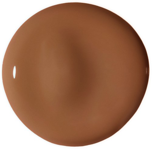 En rund, brun choklad med en glänsande yta och en liten vit fläck på sidan.