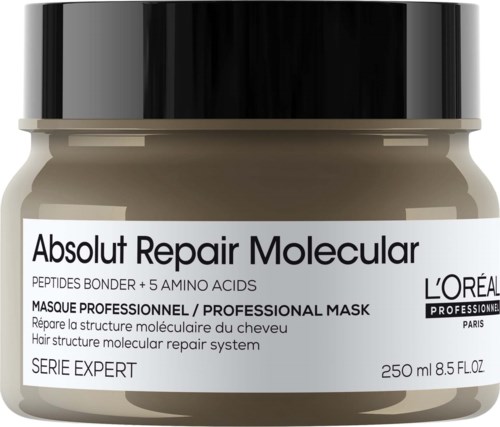 A beige and black hair mask jar labeled 'Absolut Repair Molecular' with product details and brand information.