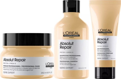 Three L'Oreal hair repair products: a mask, a shampoo, and a conditioner for damaged hair.