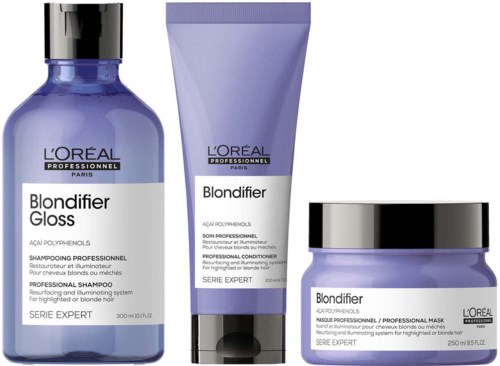 Drei Haarpflegeprodukte von L'Oreal mit lila Flaschen und silbernen Akzenten.