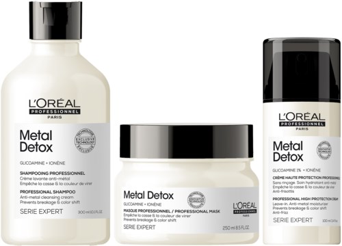 Drei L'Oréal Metal Detox Haarpflegeprodukte in weißen Flaschen mit schwarzen Deckeln, für Haarbehandlung.